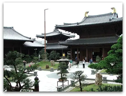 Hall of Celestial Kings and courtyard dotted with bonsai trees Hall of Celestial Kings on one end of the courtyard dotted with bonsai trees