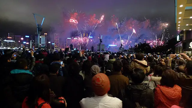 Crowds of spectators watching Chinese New Year fireworks Crowds of spectators watching Chinese New Year fireworks