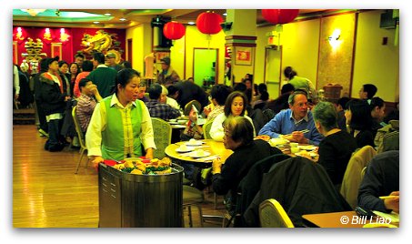 Dim Sum is served in trolleys, servers come around
the tables and diners point at what they will have Dim Sum trolleys in Hong Kong restaurant