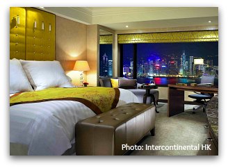 Harbour view room with Convention Center on background at Intercontinental Hotel in Hong Kong at night Harbour view room with Convention Center on background at Intercontinental Hotel in Hong Kong at night